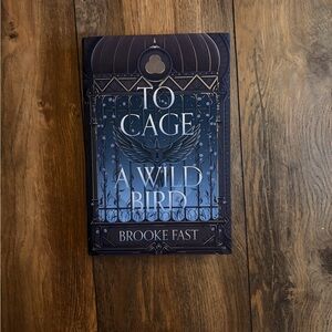 Fairyloot edition of To Cage a Wild Bird Book by Brooke Fast.
